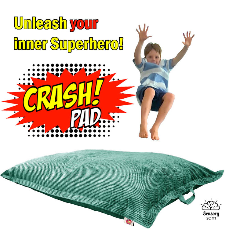 A child appears joyful while jumping onto a large, solid-color crash pad that is placed on the floor. The crash pad is advertised as a fun and safe product for play, described in the product details.