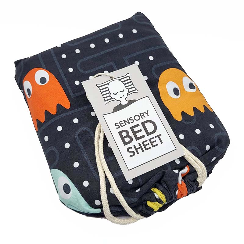 A packaged sensory bed sheet with a label showing an illustration of a character and text, designed for a single bed.