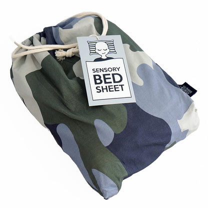Camouflage patterned sensory bed sheet packaged in a bag with a label that reads &