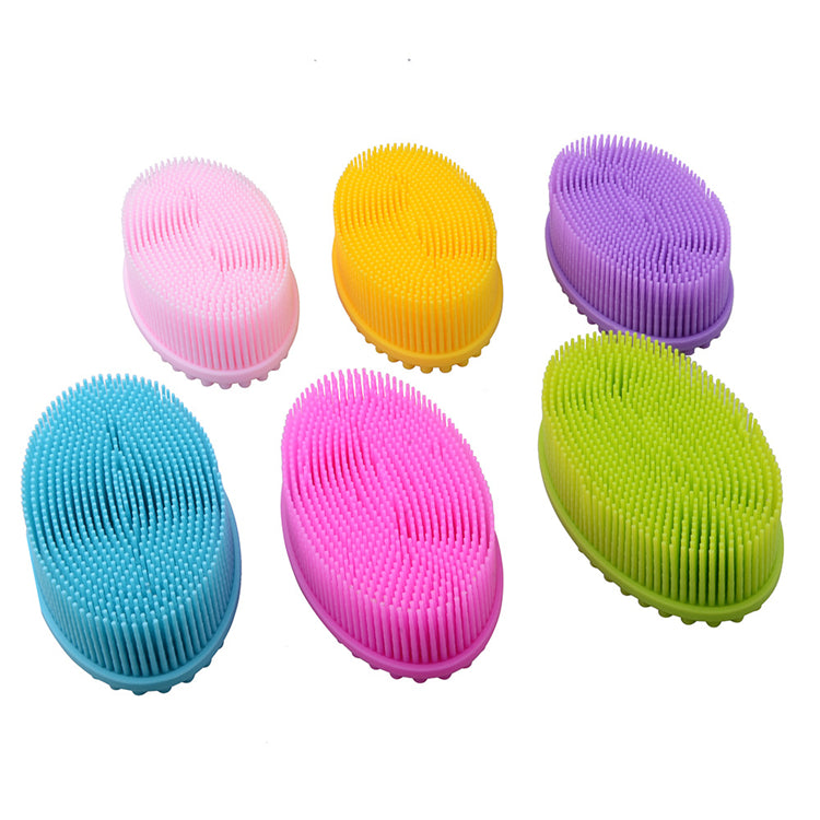 A collection of silicone sensory brushes in various colors including pink, yellow, purple, blue, and green, each with soft bristles on one side and smooth tactile bumps on the other.