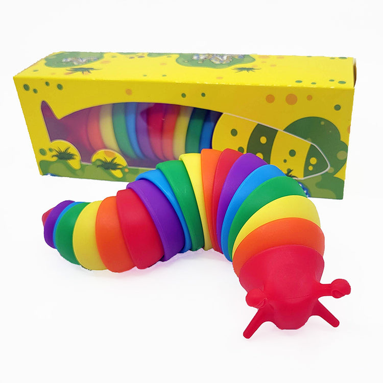 A colorful Slinky Slugs fidget toy displayed alongside its packaging, which features a cartoon slug design.