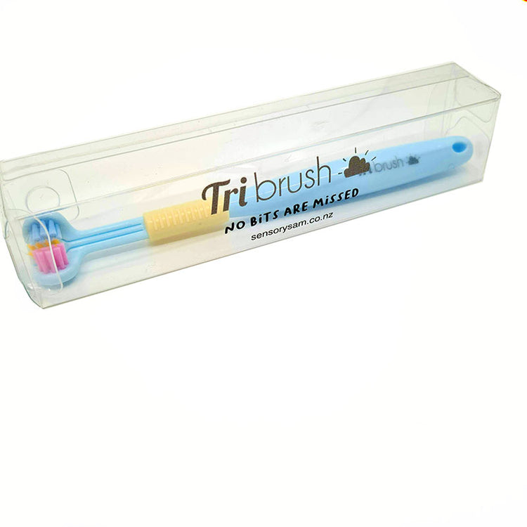 A collection of three-sided toothbrushes in various colors including pink, green, and blue.
