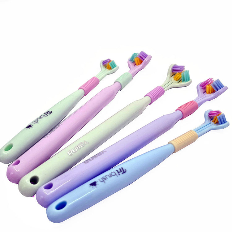 A collection of three-sided toothbrushes in various colors including pink, green, and blue.